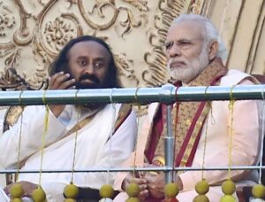 New Delhi: Prime Minister Narendra Modi with Art of Living founder Sri Sri Ravishankar during the opening day of the three-day long World Culture Festival on the banks of Yamuna River in New Delhi on Friday. PTI Photo by Kamal Kishore (PTI3_11_2016_000260B)